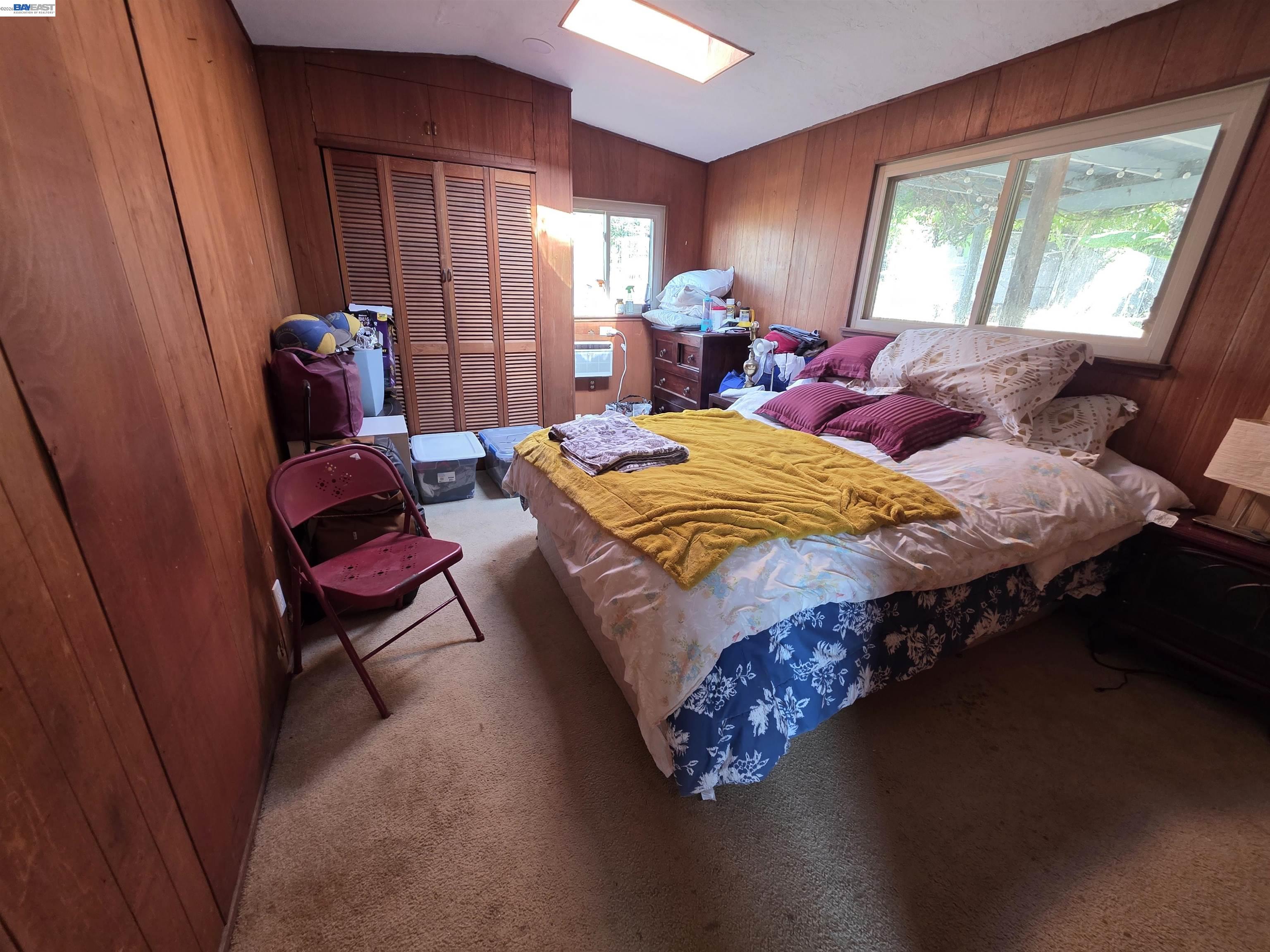 40 Sandy Beach Road Vallejo, CA 94590 - Photo 5 of 10 a bed sitting in a bedroom next to a window