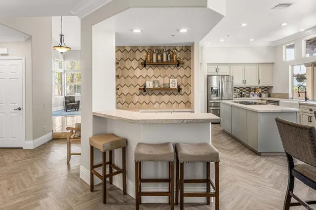 a view of a dining room with furniture and window