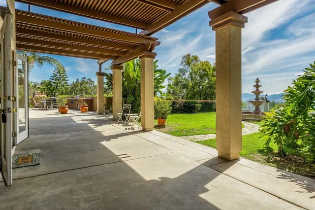 a view of a swimming pool with a patio