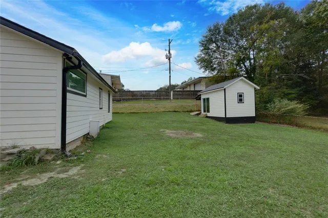 a view of an empty room and wooden floor