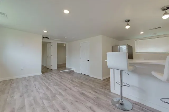 a kitchen with a sink stainless steel appliances and cabinets