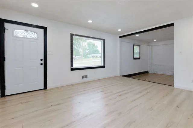 a view of an empty room with a window