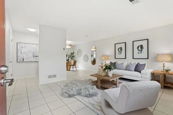a living room with furniture and a table