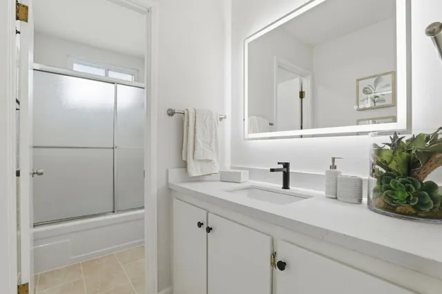 a bathroom with a sink and a mirror