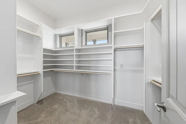 a view of an empty walk in closet
