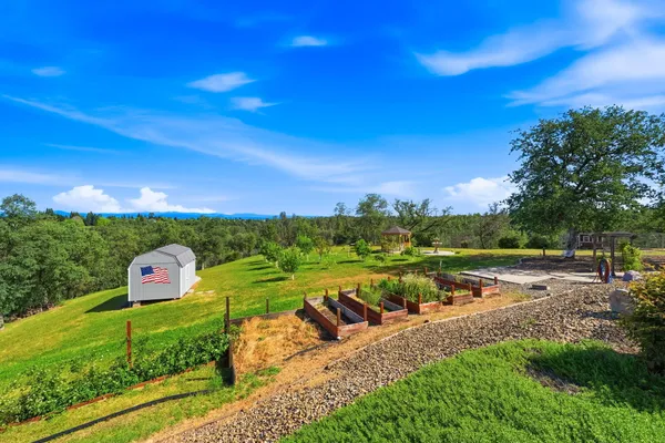 a view of balcony with a floor to ceiling window and wooden fence