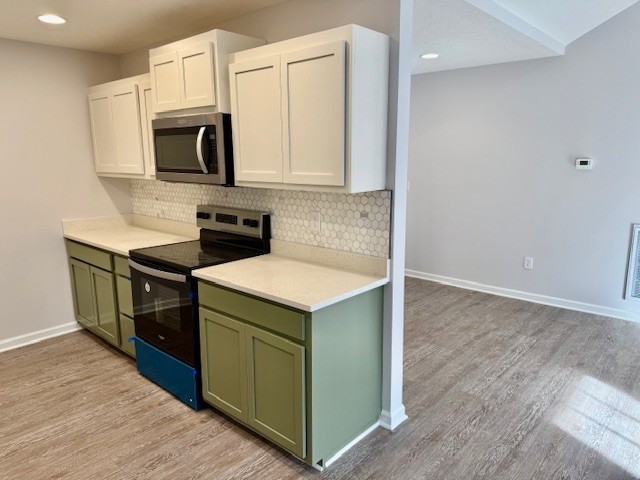 4214 Riley Creek Road Normandy, TN 37360 - Photo 14 of 46 a kitchen with a stove and a microwave