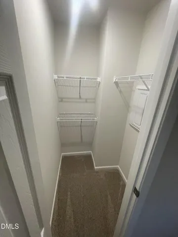 a view of storage and utility room with empty racks