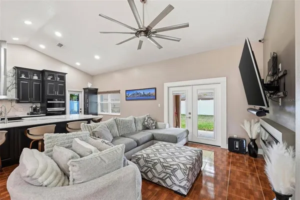 a living room with furniture and a flat screen tv