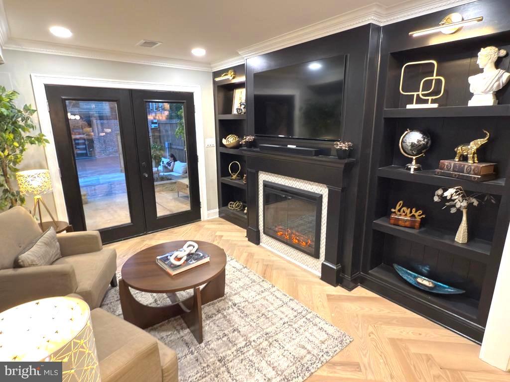 422 11th Street Southeast Washington, DC 20003 - Photo 15 of 51 a living room with furniture a flat screen tv and a fireplace