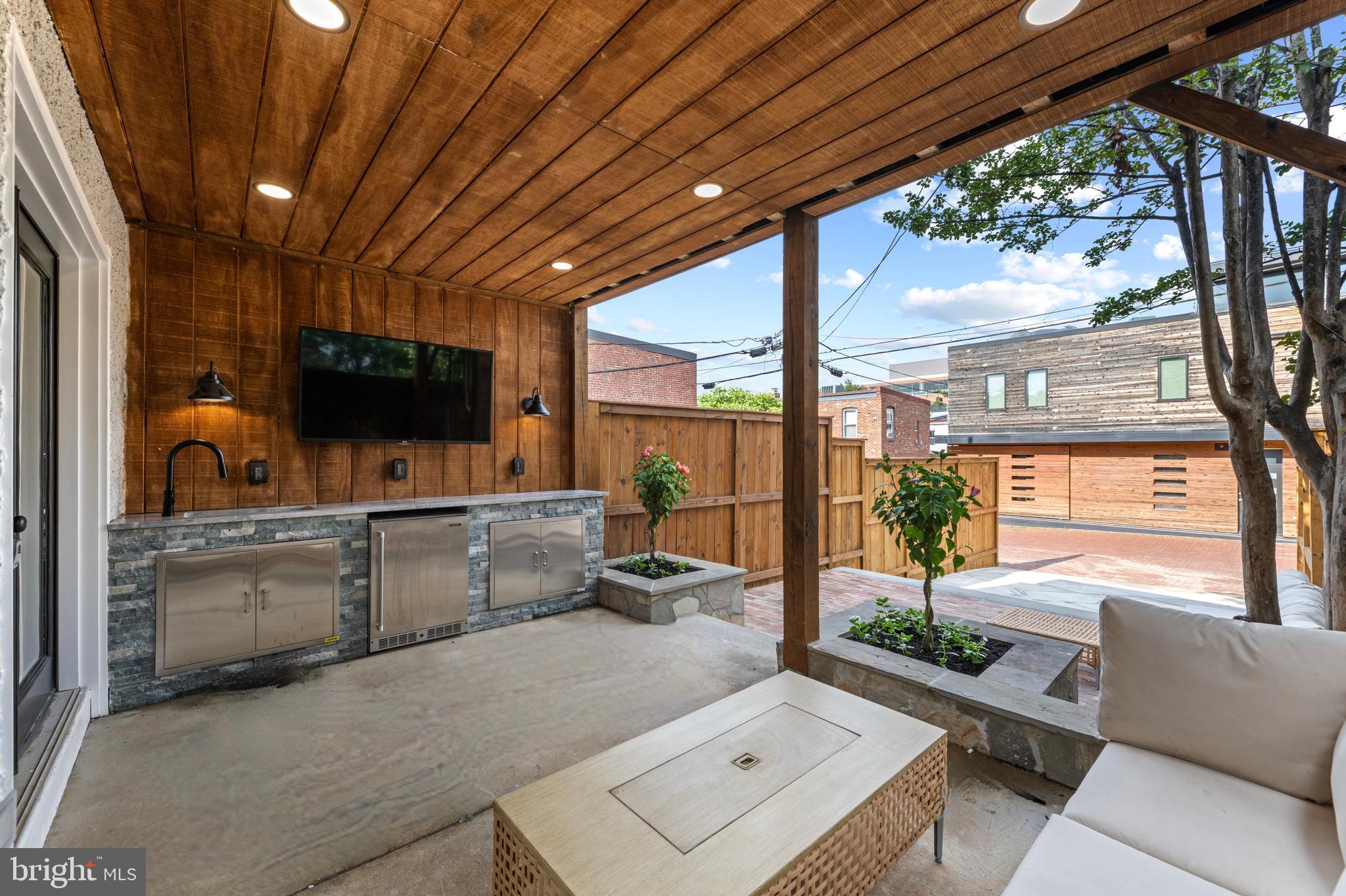 422 11th Street Southeast Washington, DC 20003 - Photo 18 of 51 a living room with furniture and a flat screen tv