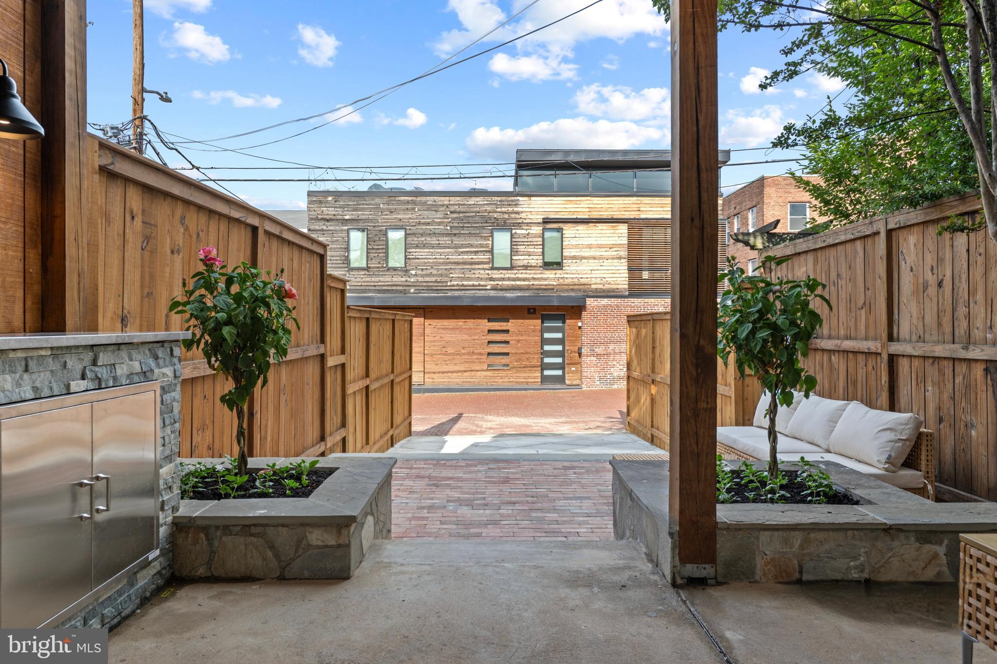 422 11th Street Southeast Washington, DC 20003 - Photo 23 of 51 Stone planters and reclaimed brick lower patio