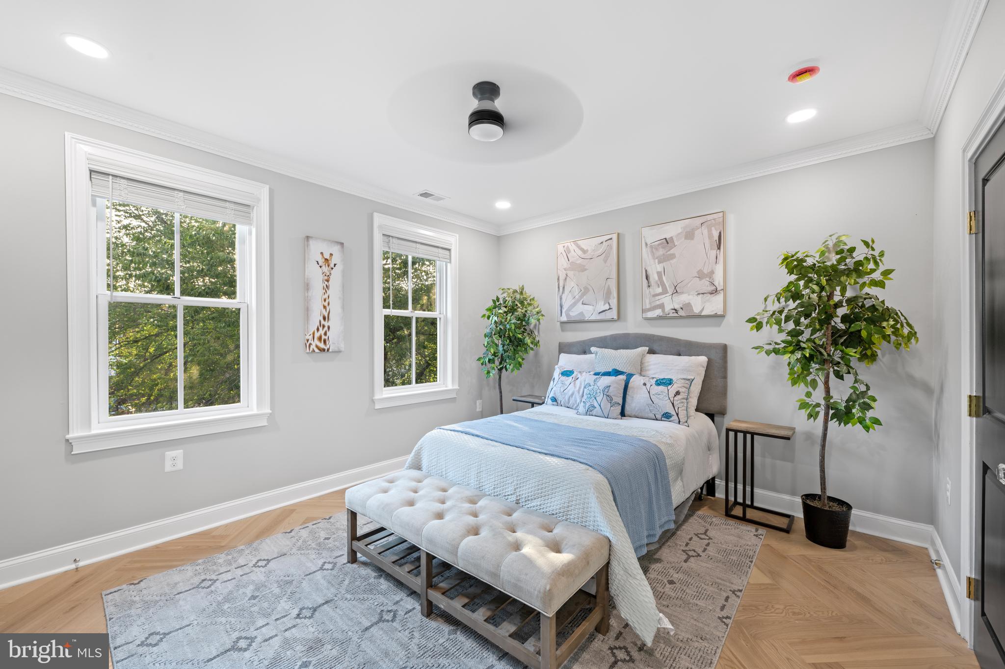 422 11th Street Southeast Washington, DC 20003 - Photo 25 of 51 a bedroom with a bed potted plant and a window