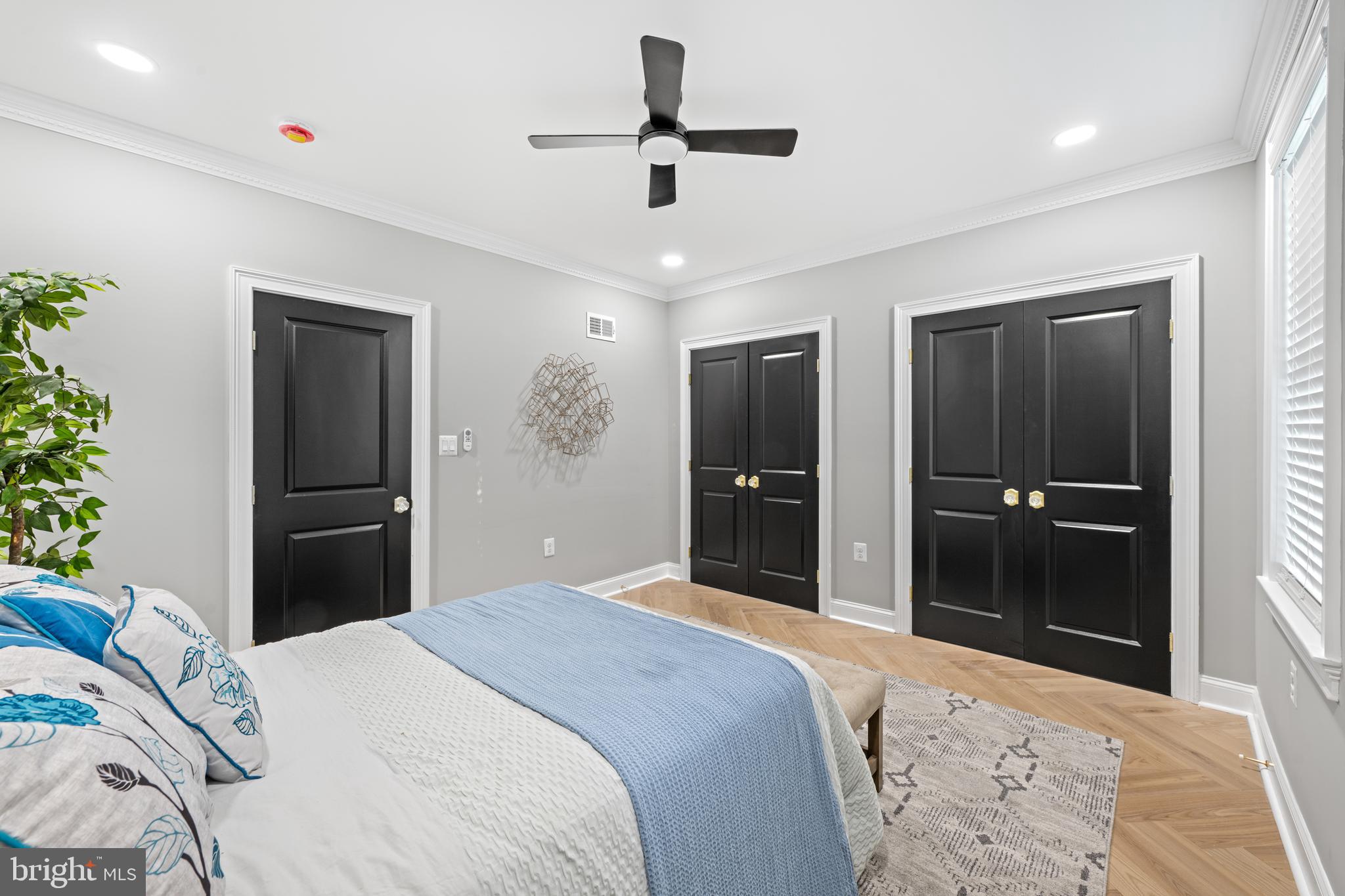 422 11th Street Southeast Washington, DC 20003 - Photo 26 of 51 a bedroom with a bed and a chandelier