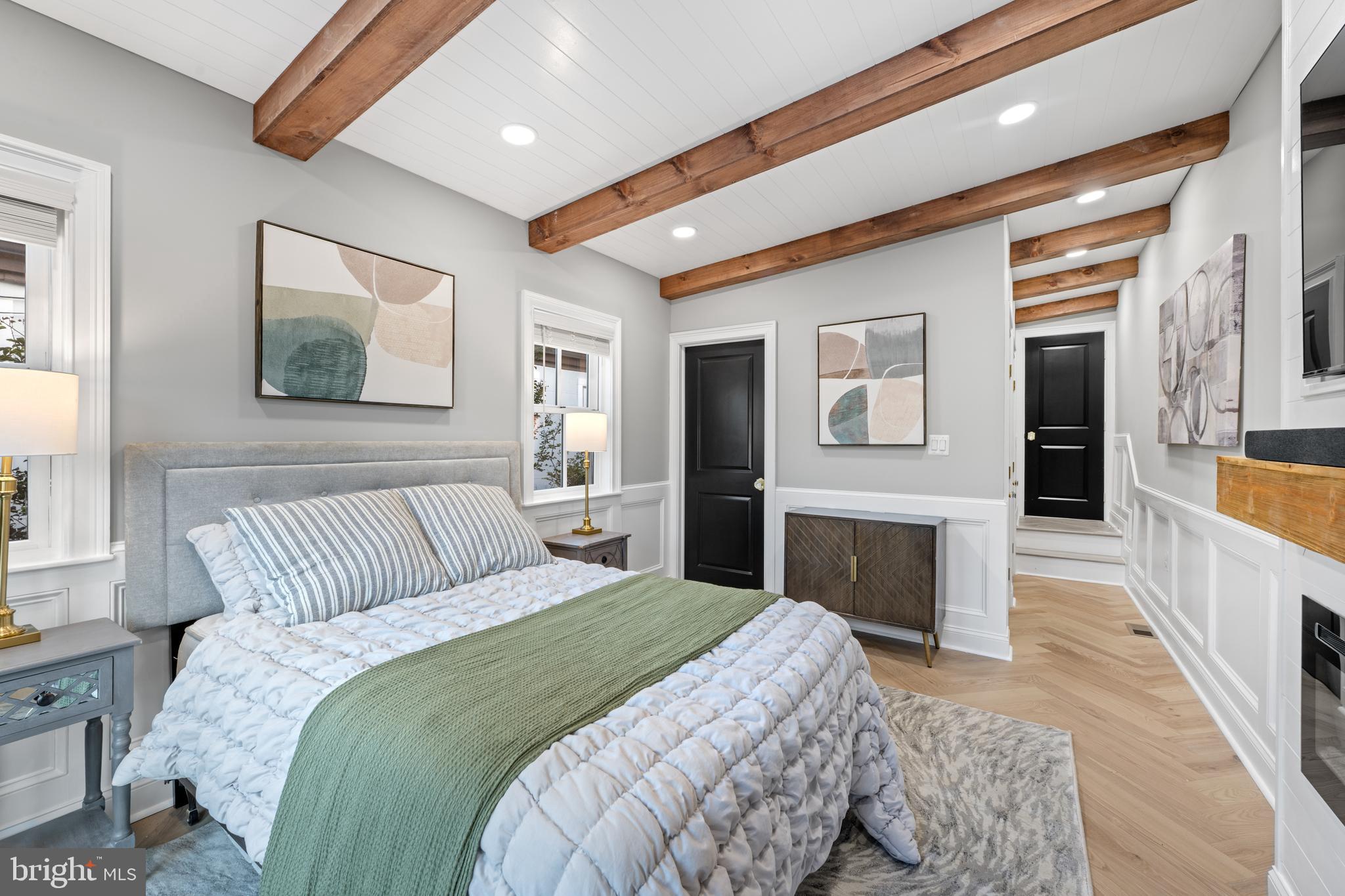 422 11th Street Southeast Washington, DC 20003 - Photo 34 of 51 a bedroom with a large bed and a couch