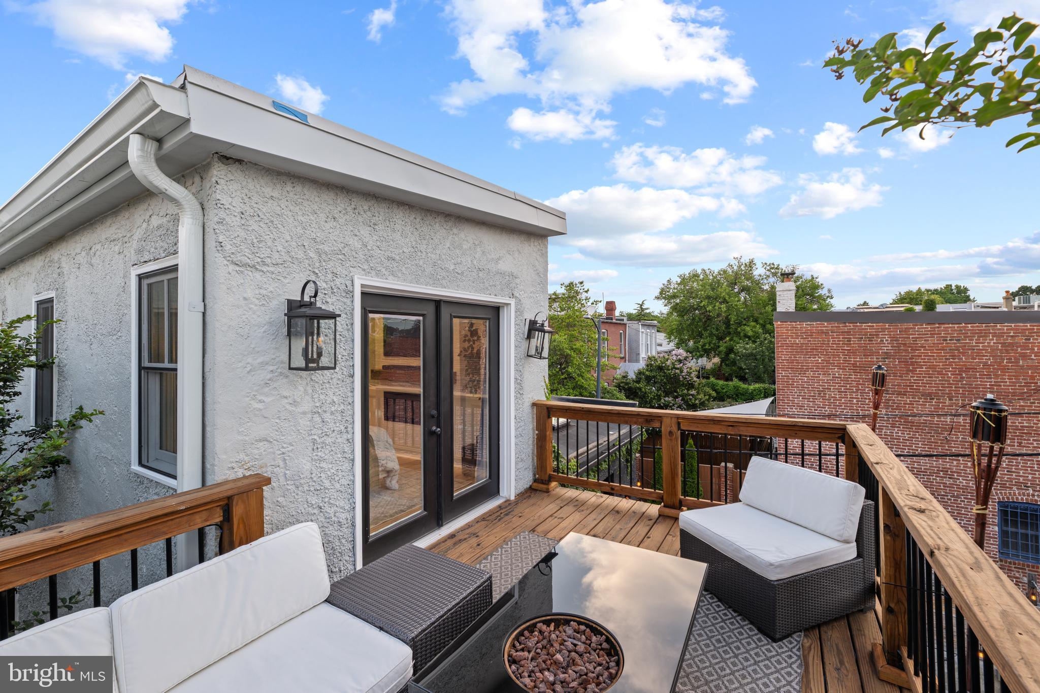 422 11th Street Southeast Washington, DC 20003 - Photo 41 of 51 a view of a patio with couches chairs and wooden floor
