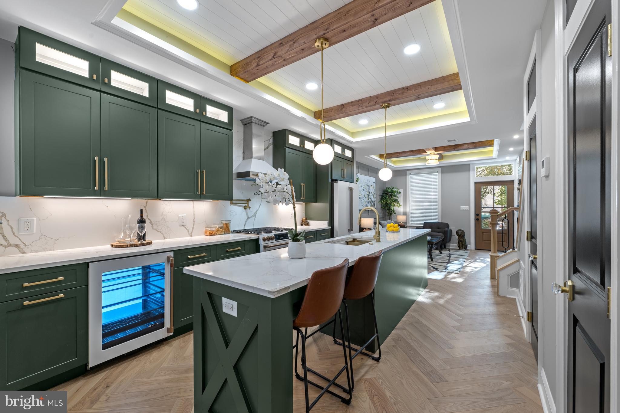 422 11th Street Southeast Washington, DC 20003 - Photo 10 of 51 a kitchen with lots of counter space a sink appliances and cabinets