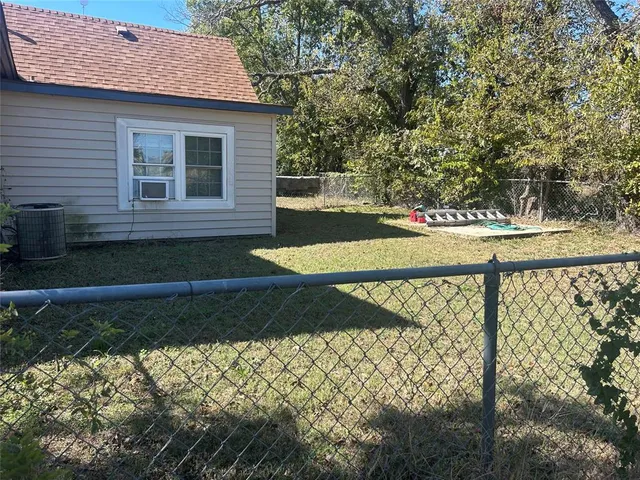 a view of a backyard of the house