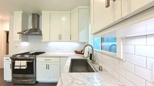 a kitchen with a sink and cabinets