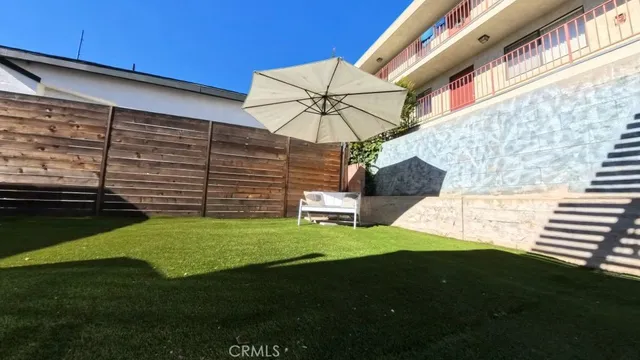 a view of a back yard of the house