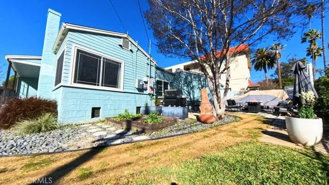 a view of a backyard of a house