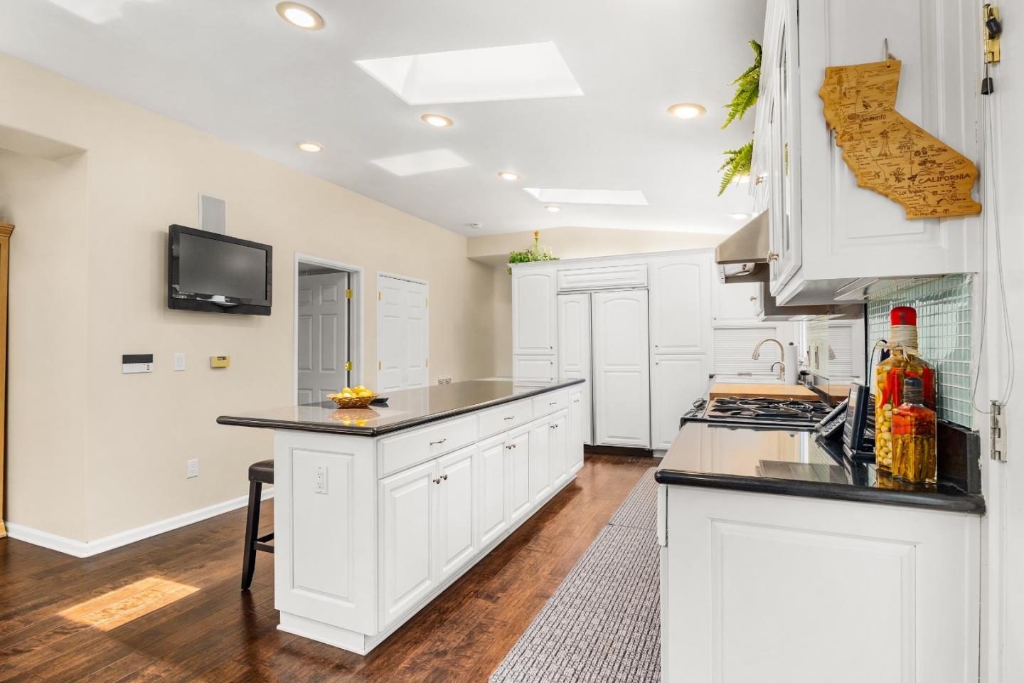 2000 Glen Canyon Road Santa Cruz, CA 95060 - Photo 11 of 41 a kitchen with stainless steel appliances kitchen island granite countertop a sink and cabinets