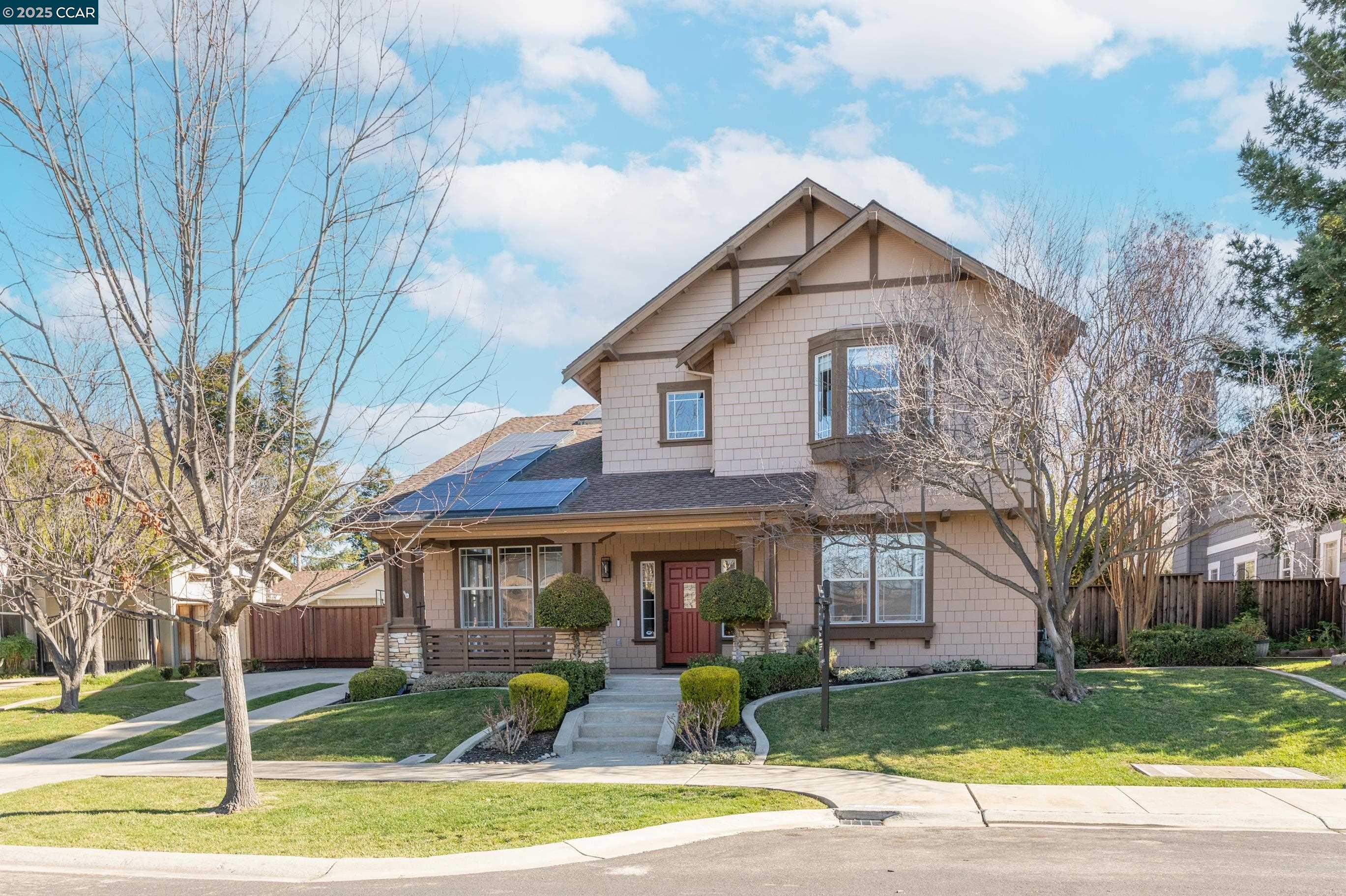 a front view of a house with garden