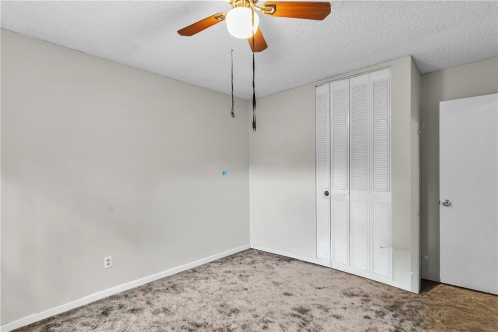 393 Cedar Trace Southwest Marietta, GA 30008 - Photo 14 of 33 a view of a livingroom with a chandelier fan