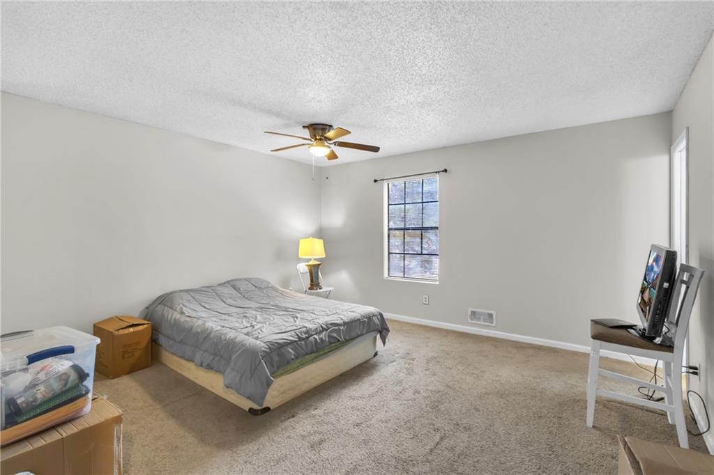 393 Cedar Trace Southwest Marietta, GA 30008 - Photo 17 of 33 a bedroom with a bed and a window