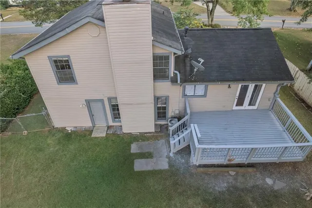 a aerial view of a house with a yard
