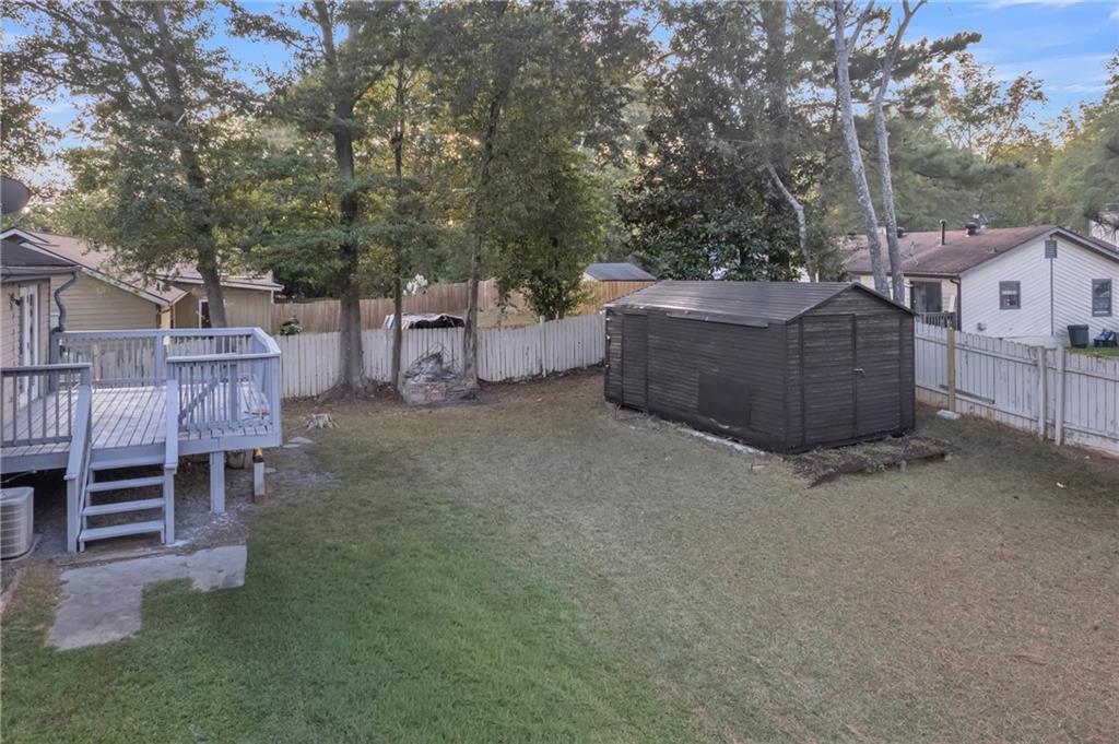 393 Cedar Trace Southwest Marietta, GA 30008 - Photo 30 of 33 a view of a chairs and table in the back yard of the house