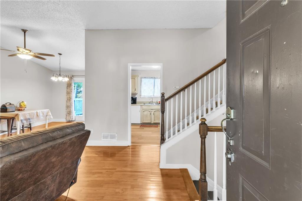 393 Cedar Trace Southwest Marietta, GA 30008 - Photo 3 of 33 a view of entryway and hall with wooden floor