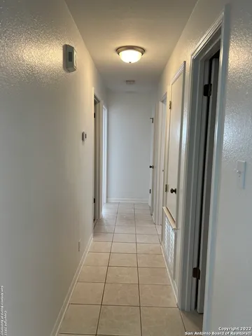 a view of hallway with a mirror