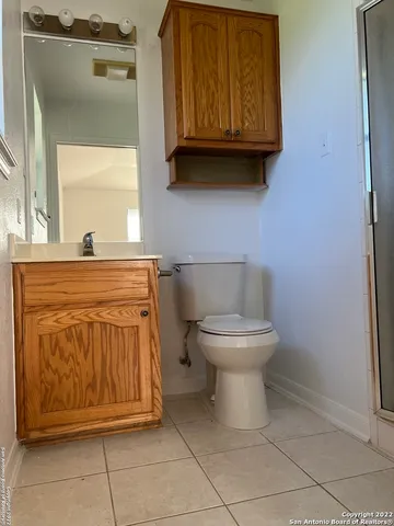 a bathroom with a toilet and a sink