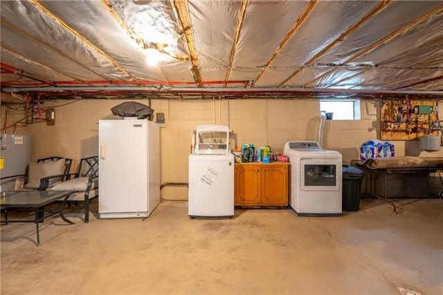 a view of a storage & utility room with washer and dryer