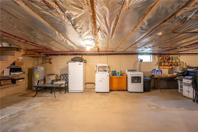 a view of storage and utility room with a washer and dryer