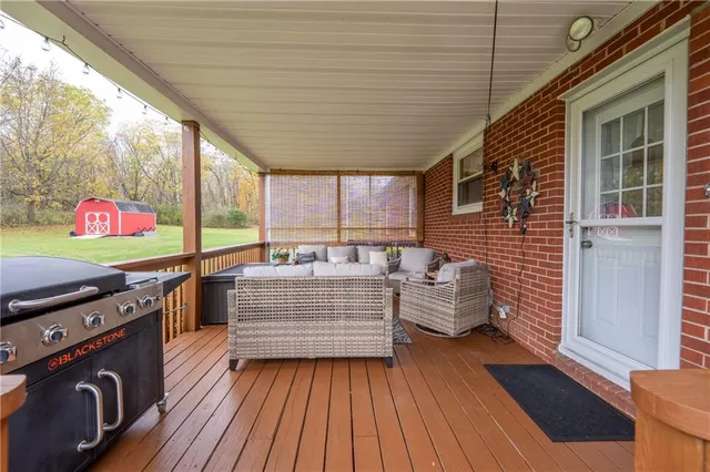 a view of living room with furniture and flat screen tv