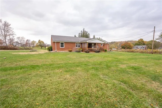 a big yard with large trees and a big yard