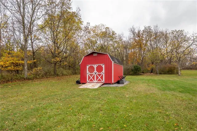 a view of outdoor space with garden and trees