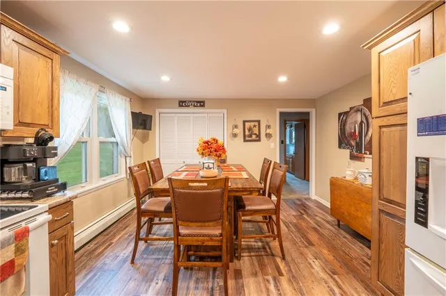 a view of a dining room with furniture window and wooden floor