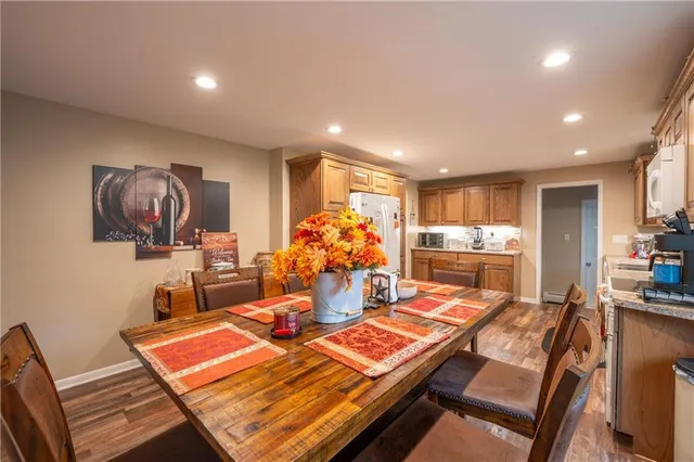 a room with furniture a flat screen tv and a table