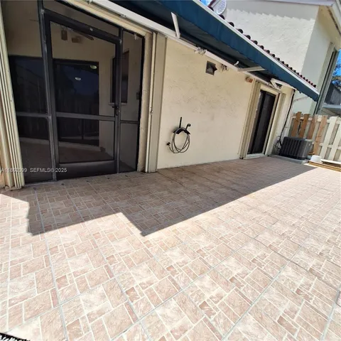 a view of a street with flower plants