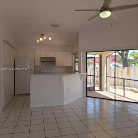 a view of a kitchen with a sink and cabinets