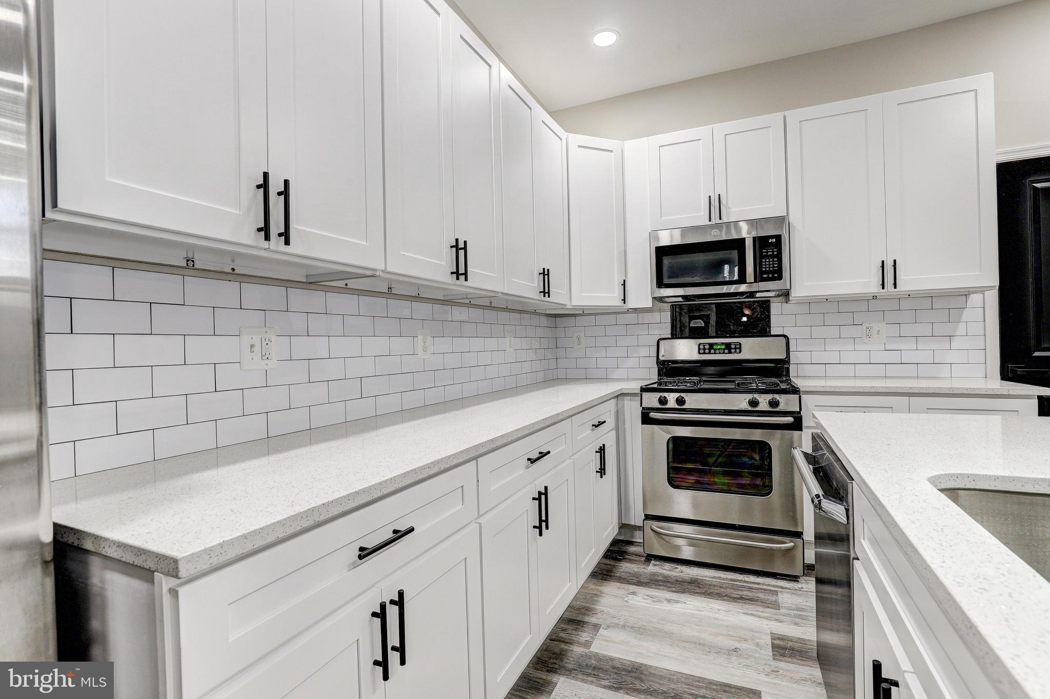 428 South Augusta Avenue Baltimore, MD 21229 - Photo 11 of 28 a kitchen with cabinets and appliances