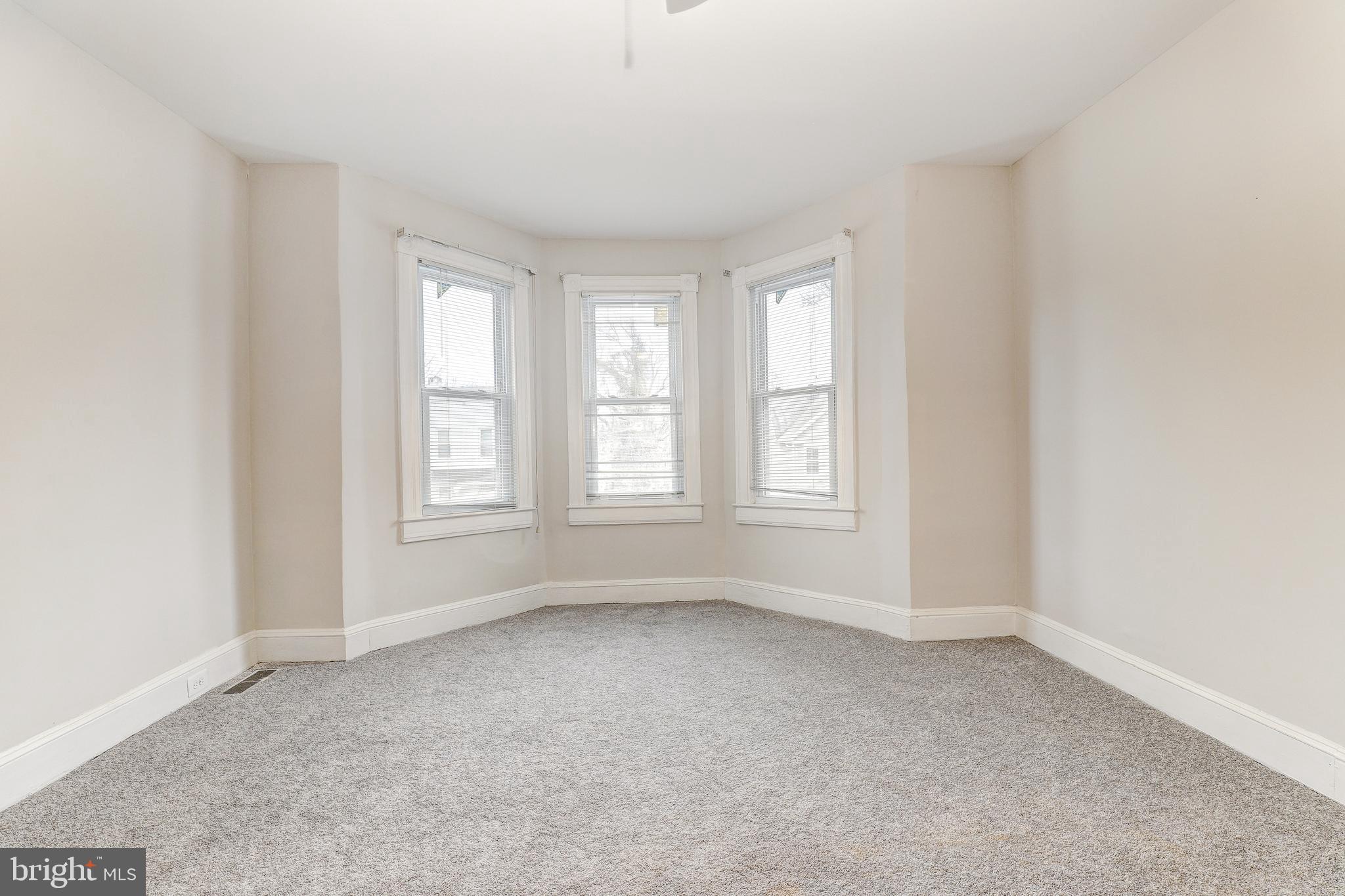 428 South Augusta Avenue Baltimore, MD 21229 - Photo 15 of 28 an empty room with windows