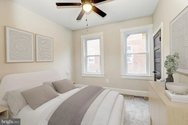 a bedroom with a large bed and a window