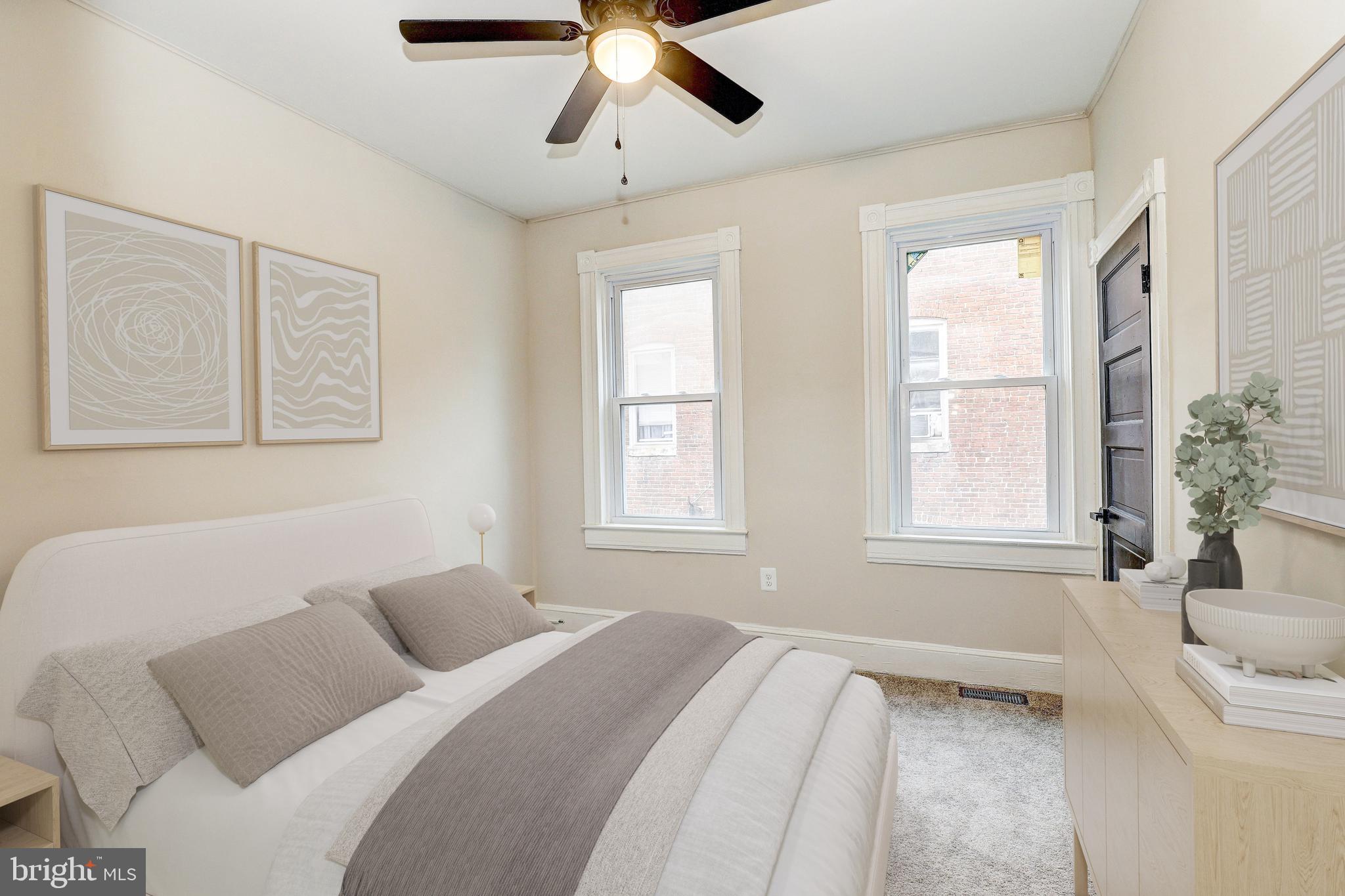 428 South Augusta Avenue Baltimore, MD 21229 - Photo 18 of 28 a bedroom with a large bed and a window
