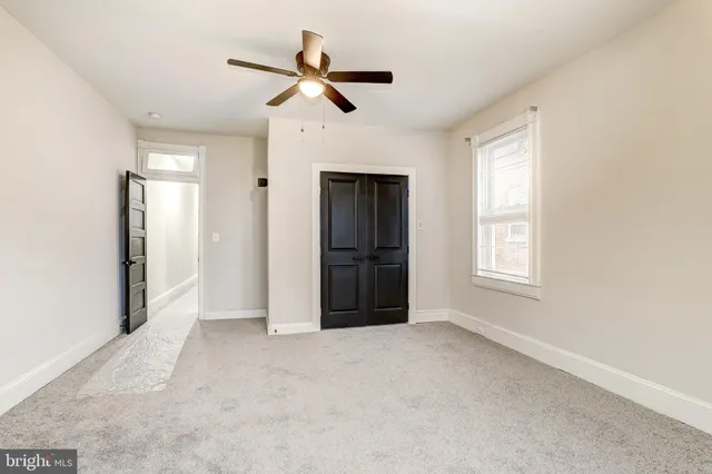 a view of empty room with windows