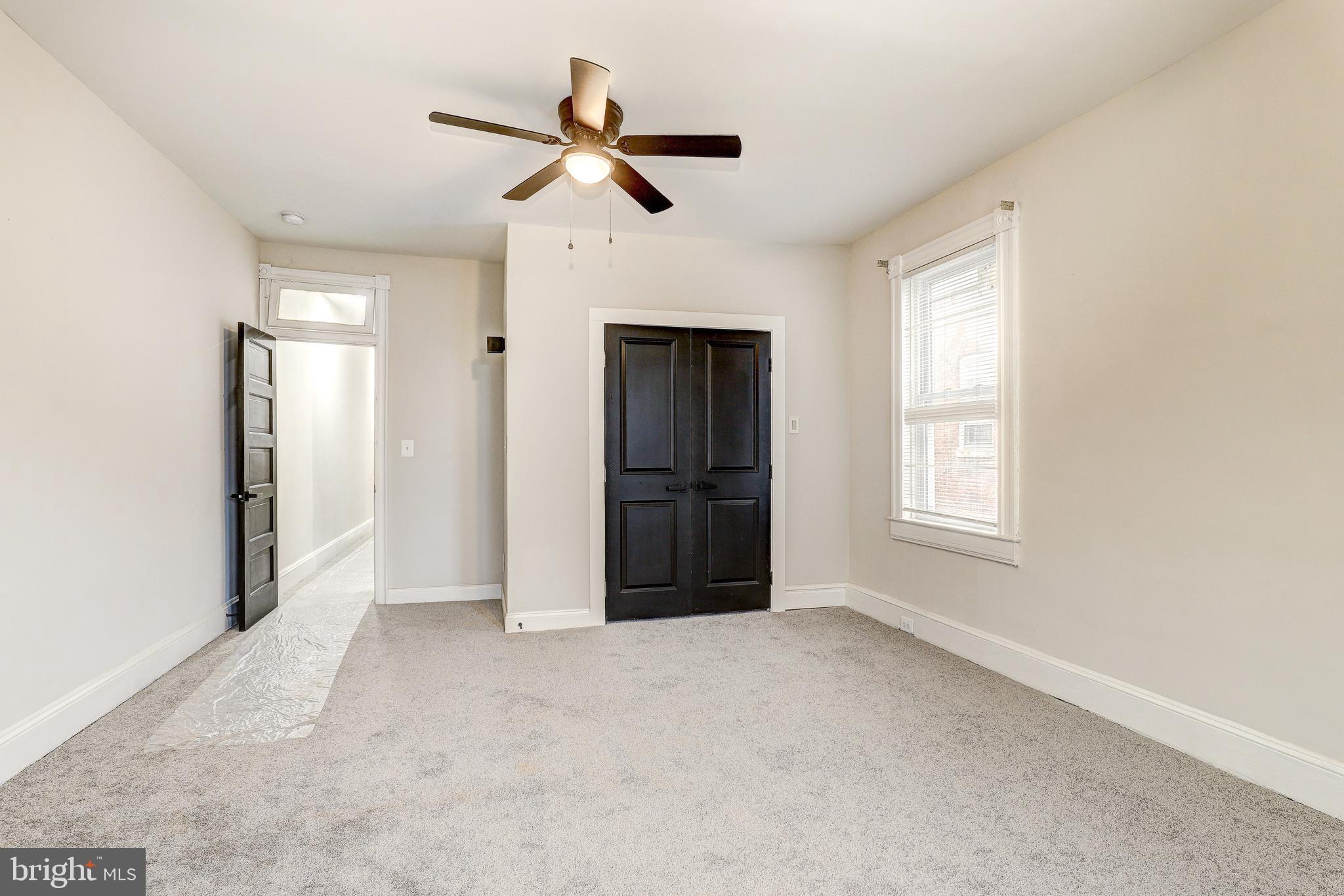428 South Augusta Avenue Baltimore, MD 21229 - Photo 19 of 28 a view of empty room with windows