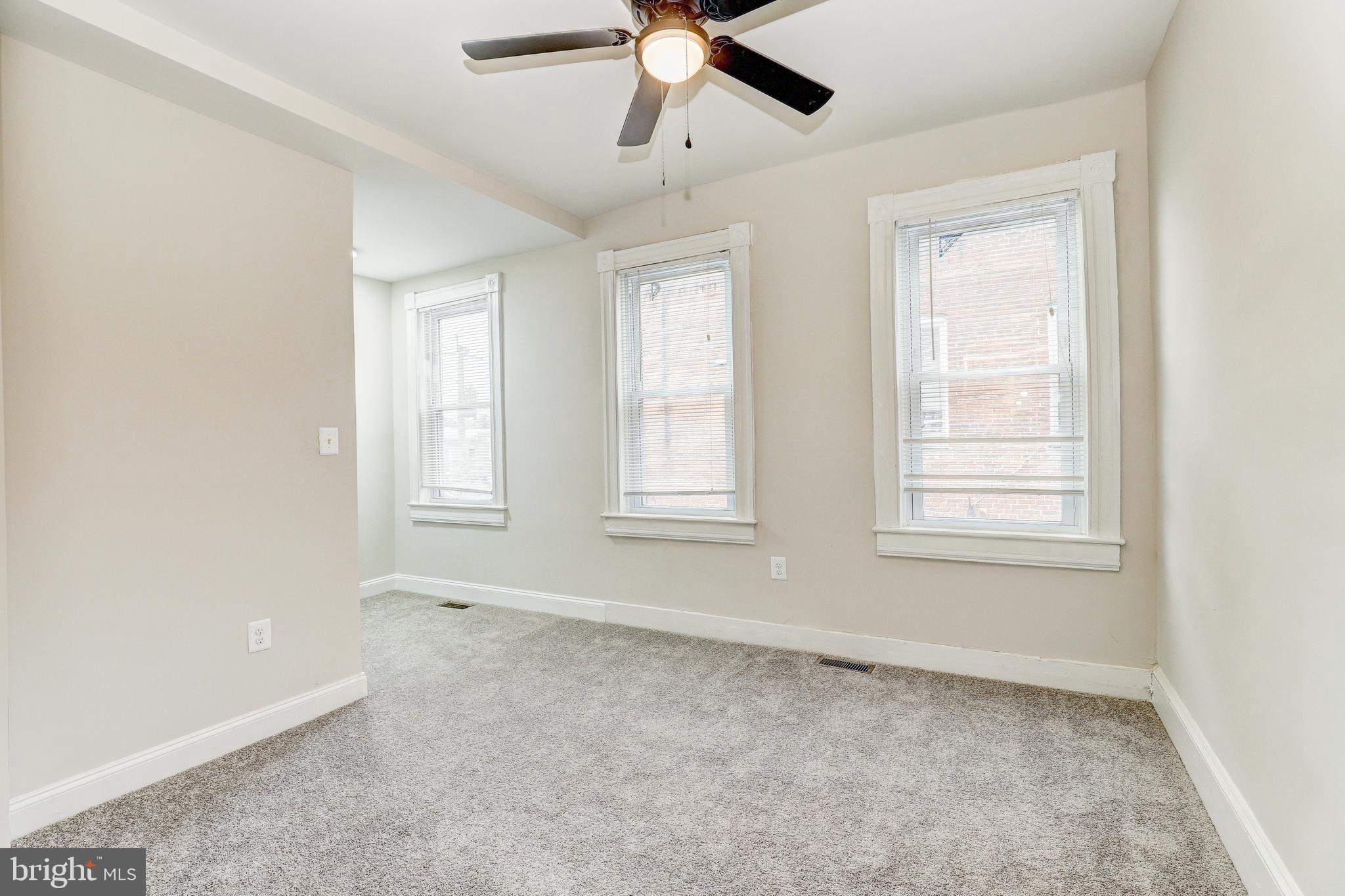 428 South Augusta Avenue Baltimore, MD 21229 - Photo 20 of 28 a view of an empty room with a window